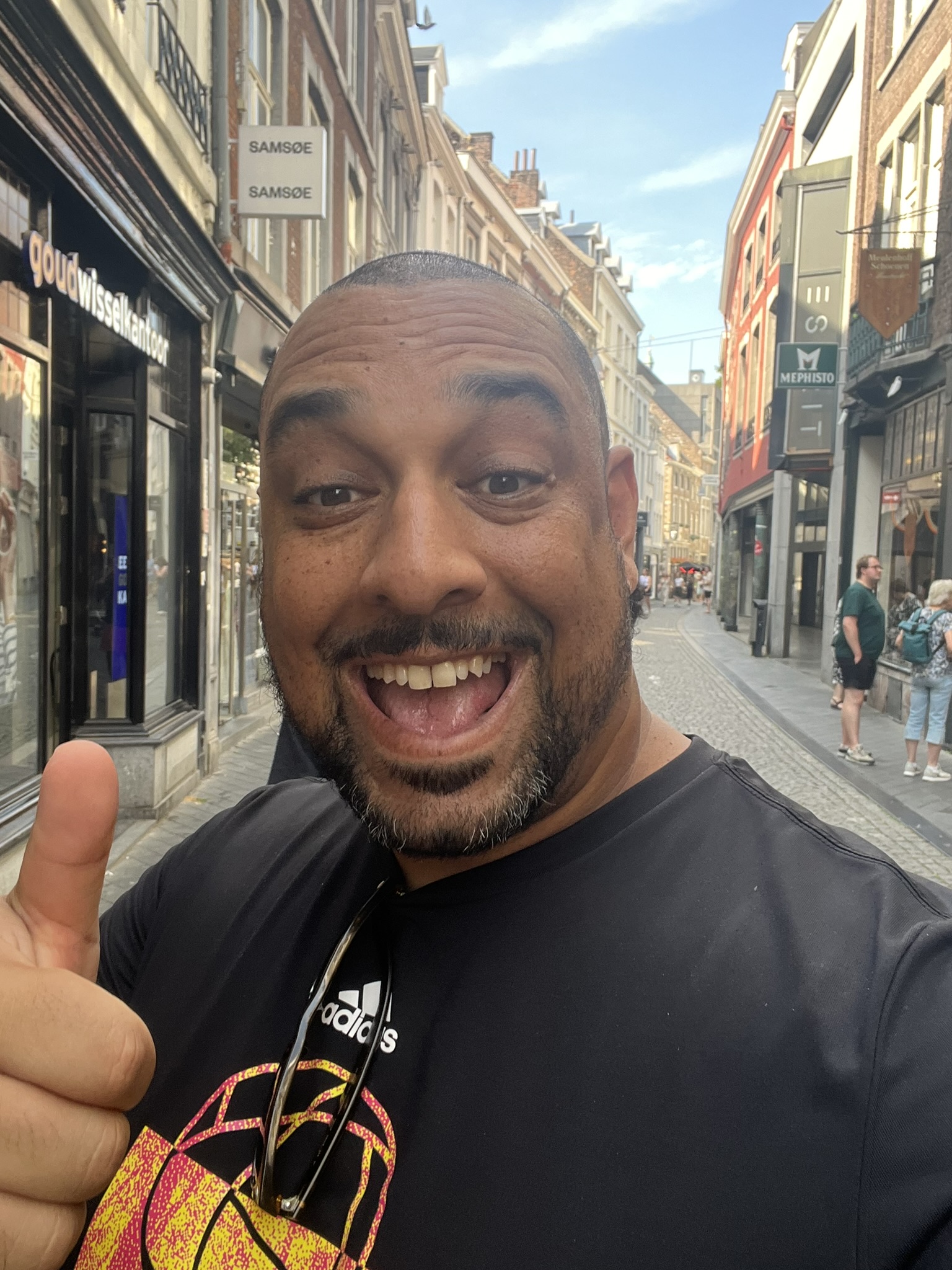 Rob Stoutenburg smiling while exploring a city