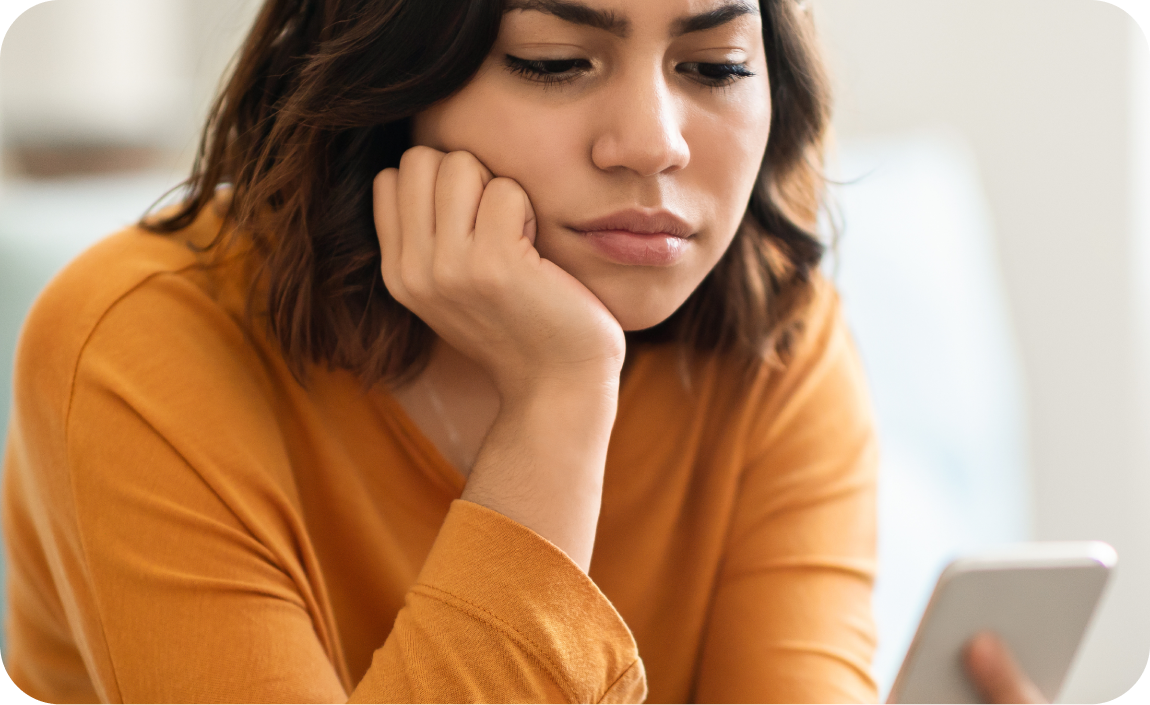 Traveler frustrated while reviewing a refund on her phone